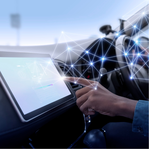 자동차 안에서 네비게이션 화면을 만지는 손 위로 네트워크 선이 이어진 사진 — 2024 Future Mobility 참가 소식 표제
